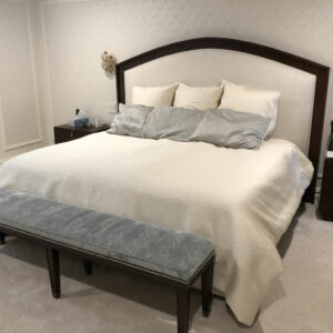A Dark Wood Themed Wood Bed Frame With White Bedding
