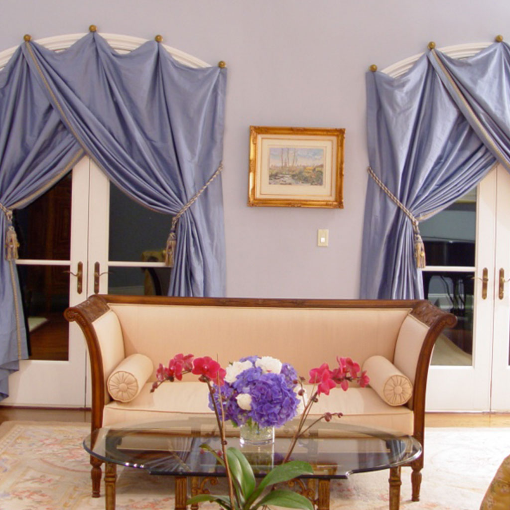 A Livingroom With Powder Blue Satin Curtains